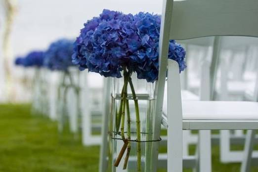 Blue aisle markers at wedding reception