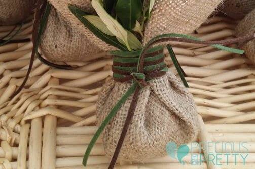 Burlap wedding favors with olive leaves and sugared almonds