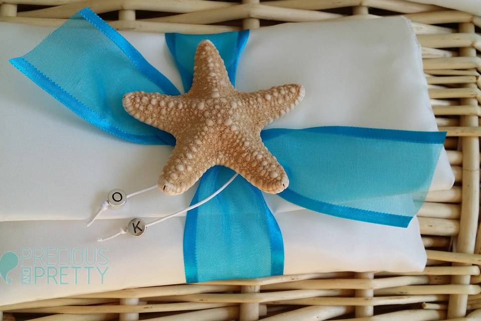 Beach wedding favors with starfish and sugared almonds