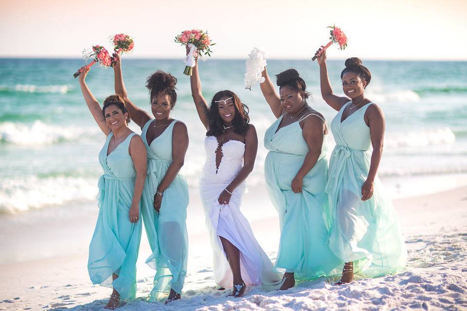 Bride and bridesmaids at the beach