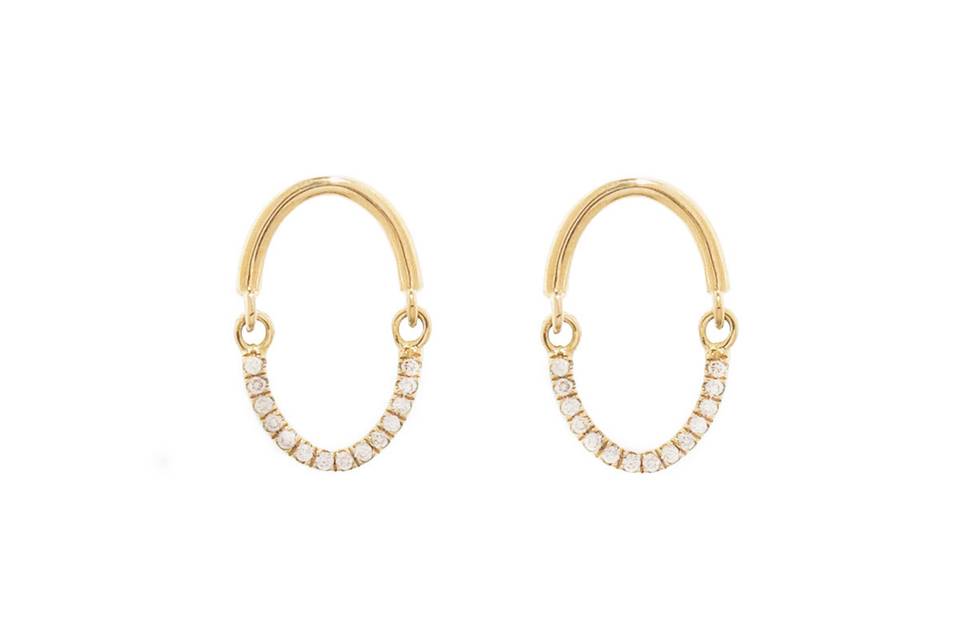 These sophisticate Yannis Sergakis earrings are delicate in size but big in impact. Set in 18 karat yellow gold, these earrings have white diamonds that are detailed on half of the earring. The diamonds total.11 carats. These earrings measure 5/8