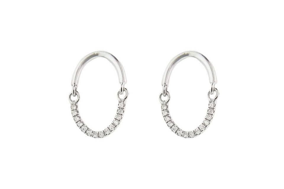 These delicate Yannis Sergakis earrings are wonderful everyday earring with a little bit of sparkle. Set in 18 karat white gold, these earrings have white diamonds that are detailed on half of the earring. The diamonds total .11 carats. These earrings measure 5/8