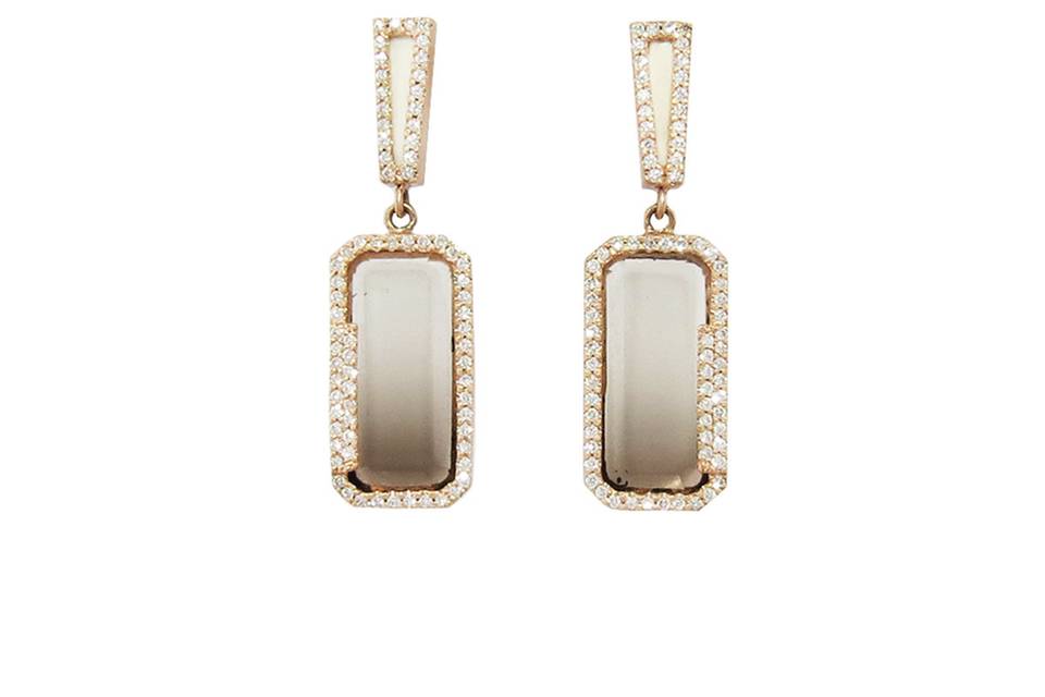 These unique earrings from designer Monique Péan have lovely movement and rest at a great length for highlighting your face. These earrings feature rectangle drops of smokey and lemon quartz, the are suspended from thin rectangles that feature fossilized woolly mammoth. The rectangles are framed in white diamonds and the diamonds total .45 carats. The posted earrings are set in recycled 18 karat rose gold and measure 1 3/16