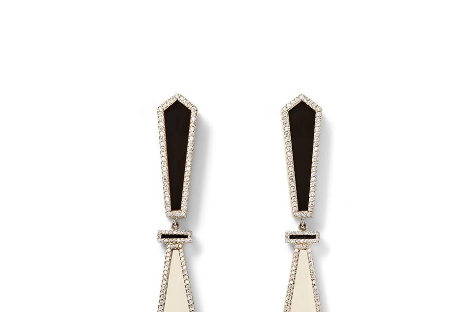These gorgeous earrings from Monique Péan are beautifully detailed in 18 karat recycled white gold. They host a a two-tier geometric setting that features a black agate above a fossilized woolly mammoth. Both tiers are framed in white pavé diamonds that total .86 carats. The earrings have a length of 2