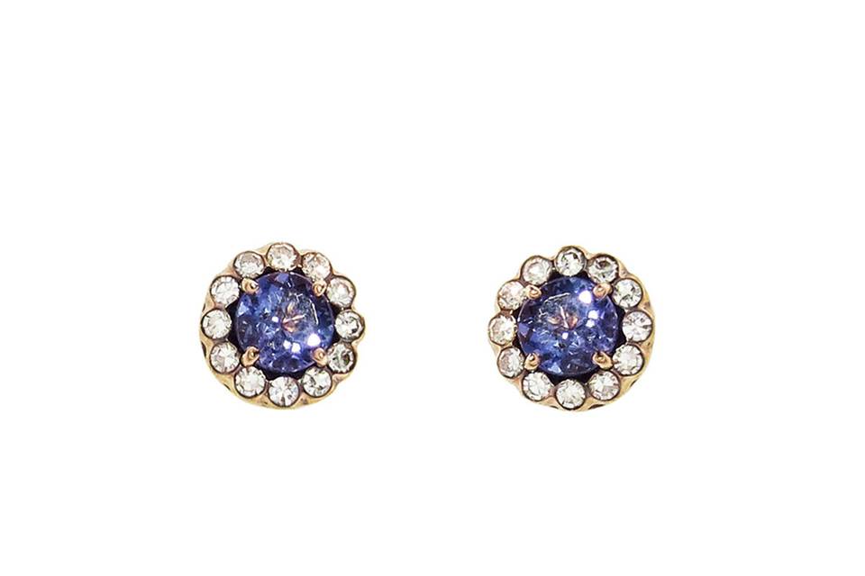 A gorgeous blue tanzanite adds the perfect amount of color to these versatile stud earrings from Selim Mouzannar. Set in 18 karat rose gold, these studs are detailed in dazzling diamonds that frame a prong set tanzanite. The earrings measure 5/16