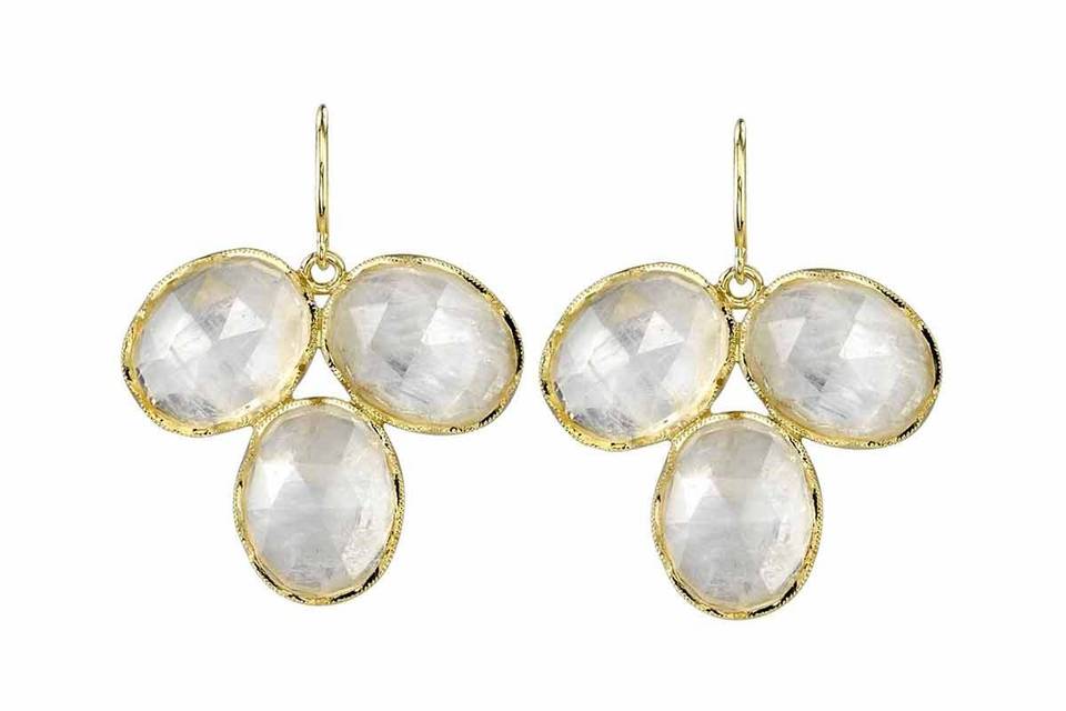 Set in 18 karat yellow gold from Irene Neuwirth, these mesmerizing earrings are composed of oval rose cut rainbow moonstones, a triple petal design that measures 7/8