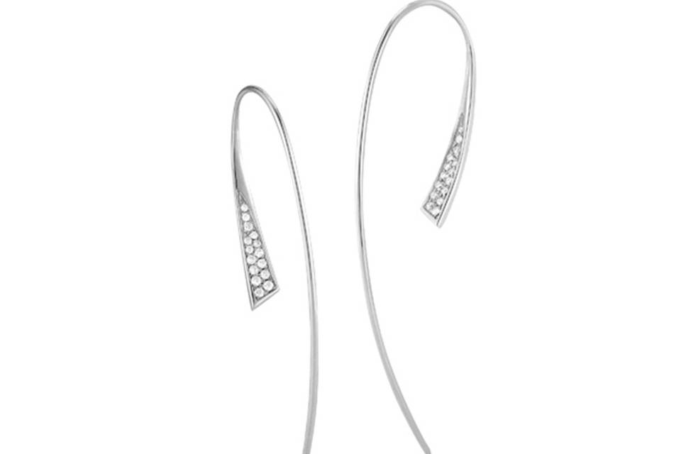 These delicate hoop earrings from designer Jade Trau are perfect for day or night. Front-facing ear wire is detailed in 14 karat white gold with round brilliant pave diamonds sharing a carat weight of 0.13 carats. They measure 2