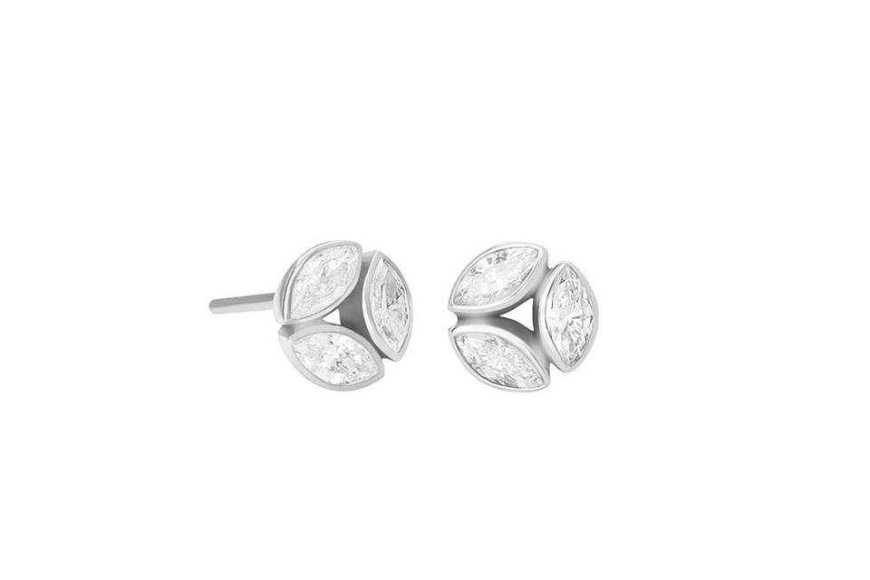 These gorgeous studs from New York designer Melissa Kaye are detailed in 18 karat white gold and feature a triplet of marquis diamonds that add touch of sparkle. Each stud has a diameter of 1/4