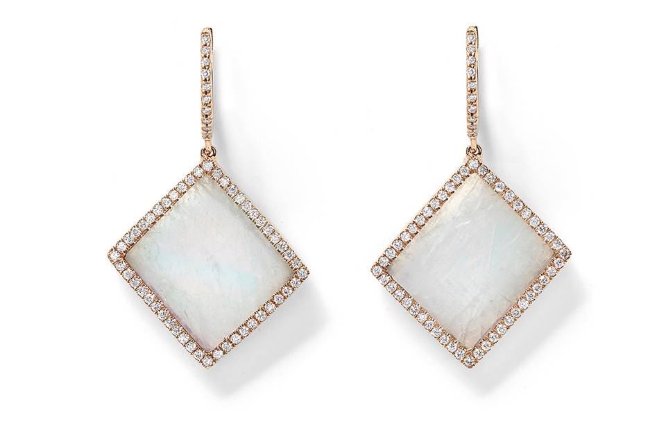 Set in recycled 18 karat rose gold, these gorgeous earrings from jewelry designer Monique Pean have moonstone slices framed in .59 carats of pave diamonds that add a touch of shimmer. They are suspended from pave hoops, creating a total length of 1 1/4