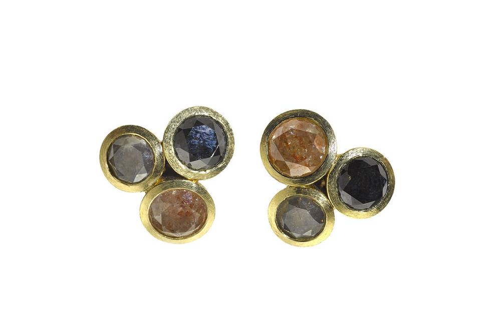 From Todd Reed in 18 karat gold, these gorgeous studs have a triplet of fancy colored diamonds individually bezel set. The diamonds share a carat weight of 5.71 carats and the studs measure 9/16