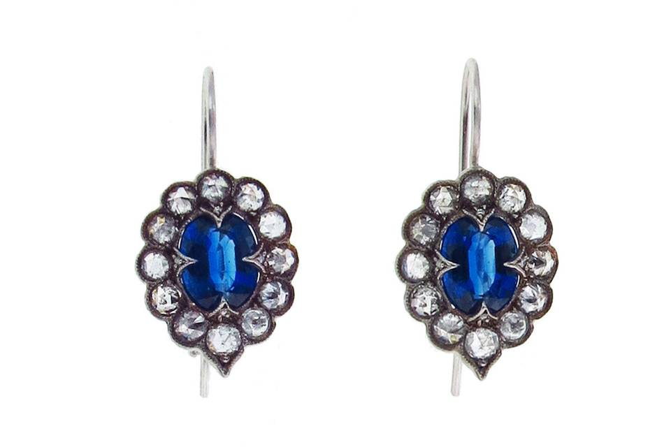 From jewelry designer Cathy Waterman, these unique earrings have an oval kyanite center with a rose cut diamond frame. Set in blackened platinum, the earrings measure 11/16