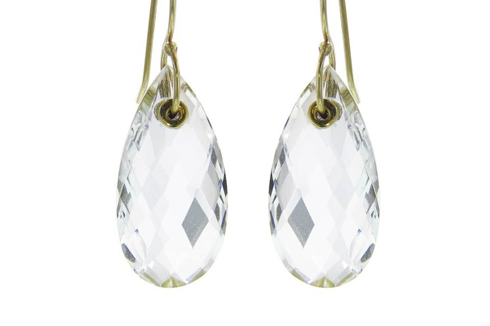These lovely earrings from designer Jamie Joseph are composed of 14 karat yellow gold ear wires with 3/4” faceted teardrop rock crystals. They have wonderful movement and are perfect for your everyday look.