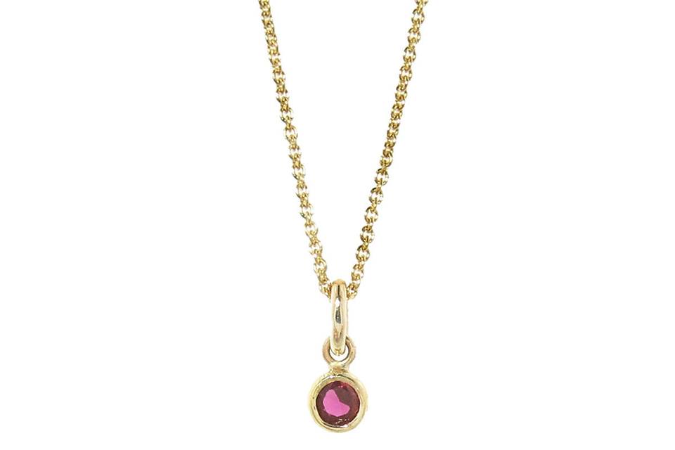 The perfect pop of color for everyday! This new necklace from Jennifer Meyer is a must-have! Fashioned in 18 karat yellow gold this necklace features a single bezel set ruby. The ruby is on a 16