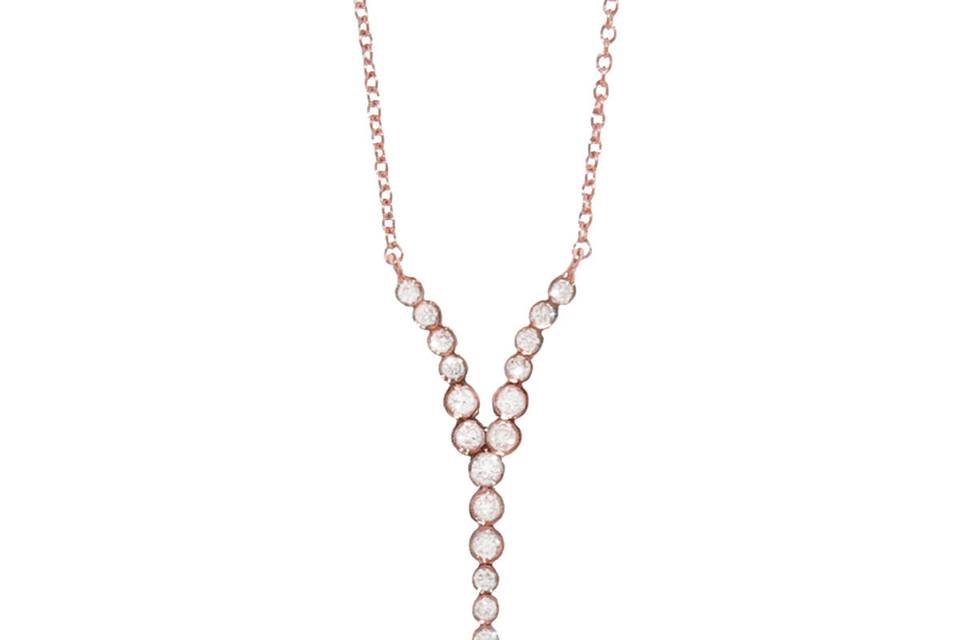 This delicate necklace is an absolute must-have piece! Detailed by hand in 18 karat rose gold, this necklace by Yannis Sergakis features individually bezel set diamonds that total .15 carats in an organic point. The pendant measures 13/16