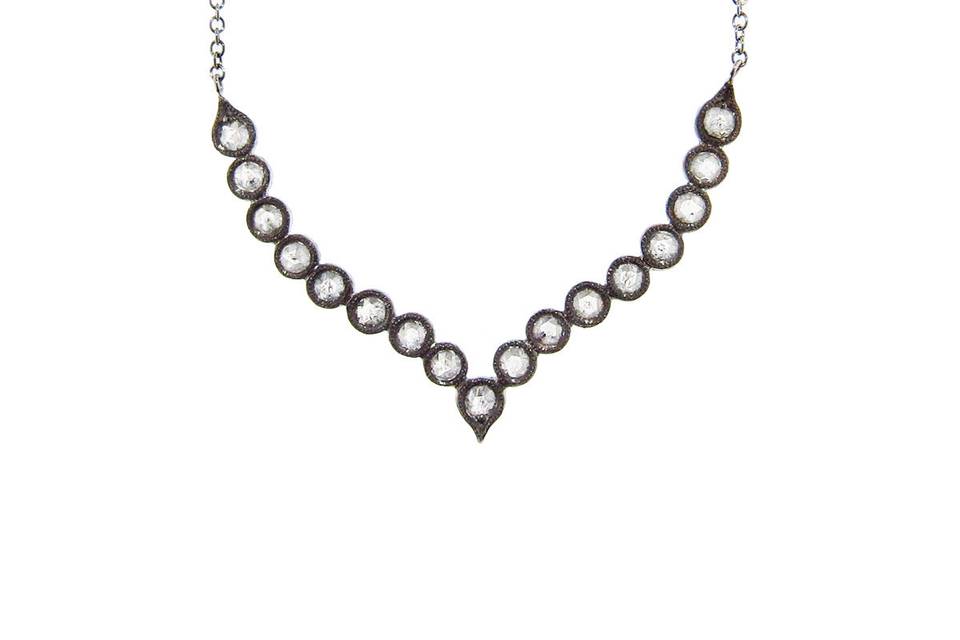 This necklace from Cathy Waterman is detailed by hand in platinum and offers an elegant display of 1.14 carats of rose cut diamonds individually bezel set and finished with a blackened rhodium. The diamonds are set in a curve that lays beautifully on the neck and it is suspended from a fine 16