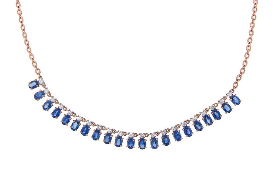 Set by hand in 18 karat rose gold, this gorgeous chain by jewelry designer Irene Neuwirth is bound to be a favorite. Small, oval Ceylon sapphires (14.07cts) are prong set and topped with brilliant cut diamonds that share a total carat weight of 1.68 carats. The chain measures 18