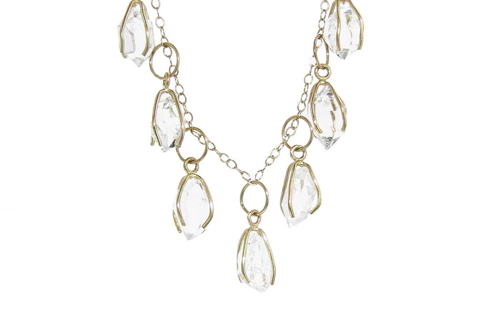 This delicate necklace from Melissa Joy Manning is composed of recycled 14 karat yellow gold, a fine chain with nine caged Herkimer diamond drops. The chain measures 18