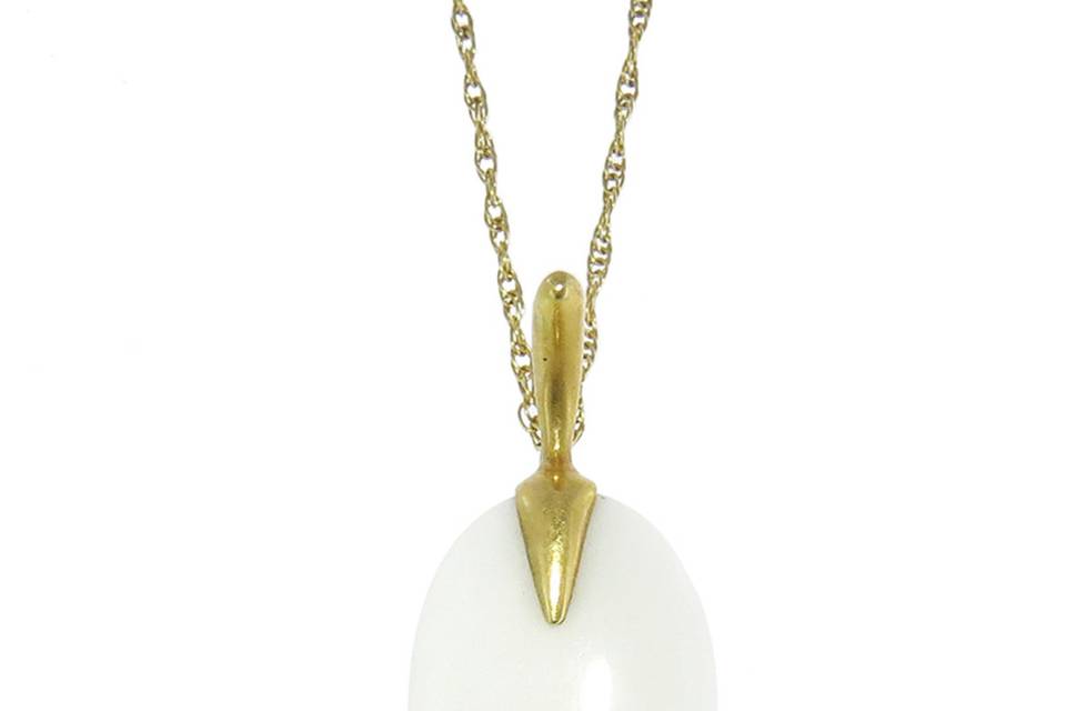 This soft pendant from Annette Ferdinandsen, in 18 karat yellow gold, is composed of a white cocolong teardrop set in her signature bird setting. Pendant measures 1 1/2