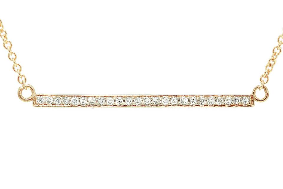 This delicate necklace from designer Jennifer Meyer is fashioned in 18 karat rose gold. A thin diamond stick that measures 1