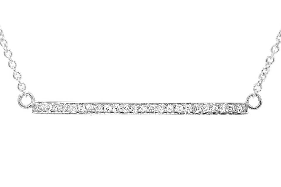 This delicate necklace from designer Jennifer Meyer is fashioned in 18 karat white gold. A thin diamond stick that measures 1