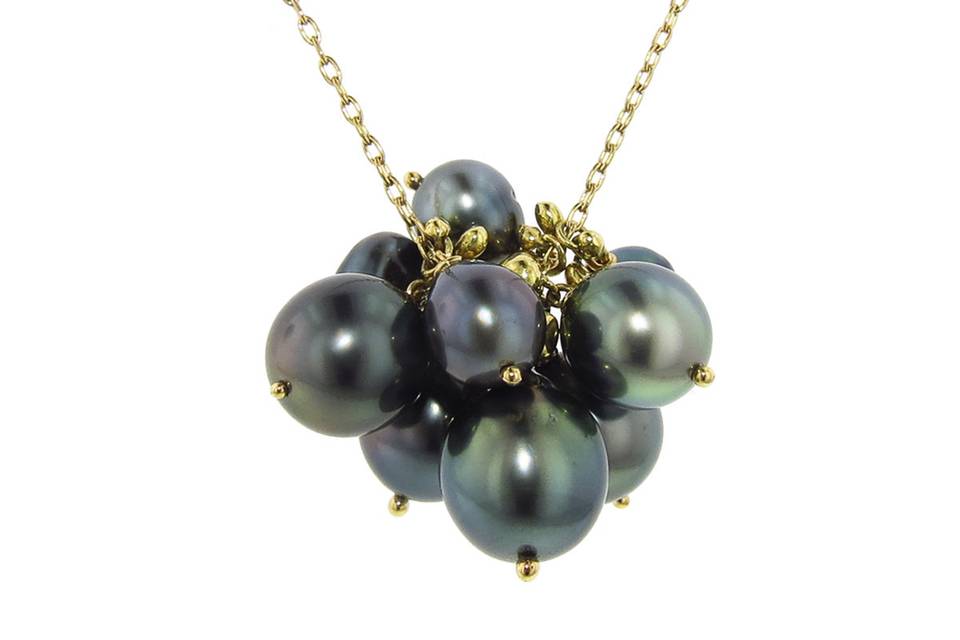 This gorgeous cluster of pearls from TenThousandThings is set in 18 karat gold and hangs from a long 32