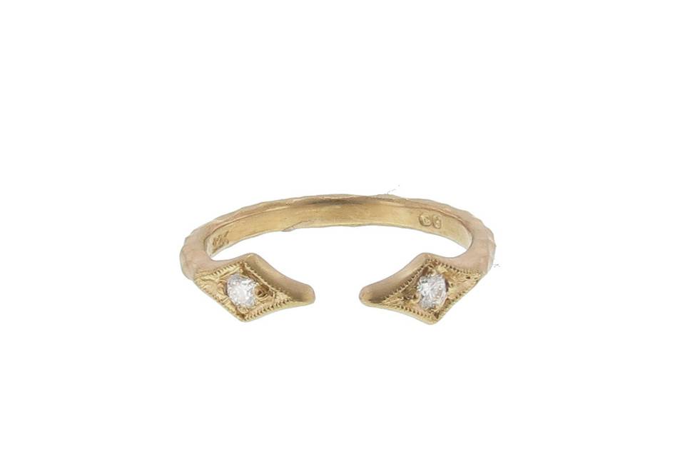 This stacking ring from Cathy Waterman is one of our favorites! The open center, thick hammered band is set in 22 karat gold and finished with two thorn ends each detailed with a sparkling diamond. This ring looks amazing stacked with a solitaire rose or rustic cut diamond ring.