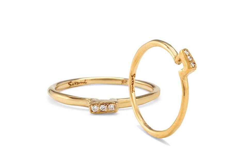 Each ring from designer Satomi Kawakita is handmade with impeccable precision. This triple diamond plateau band, crafted from 18 karat yellow gold, is no exception. Detailed and lovely in a ring stack.