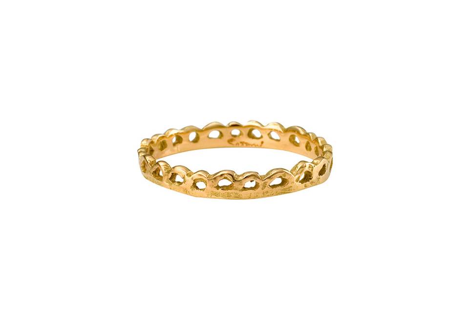 Each ring from designer Satomi Kawakita is handmade with impeccable precision. This small textured lace band, crafted from 18 karat yellow gold, is no exception. Detailed and lovely in a ring stack.