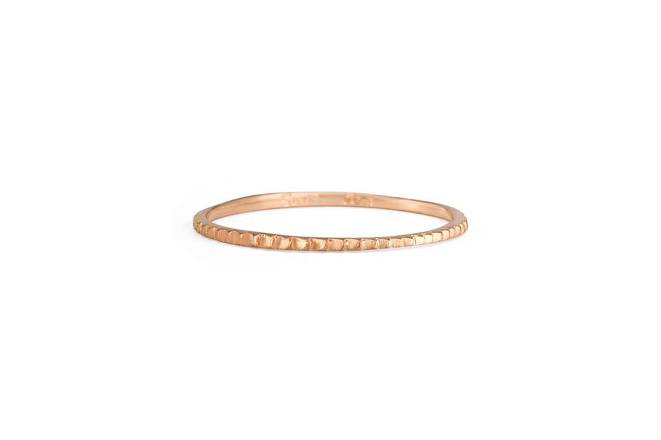 Each ring from designer Satomi Kawakita is handmade with impeccable precision. This petite gear band, crafted from 18 karat rose gold, is no exception. Detailed and lovely in a ring stack.