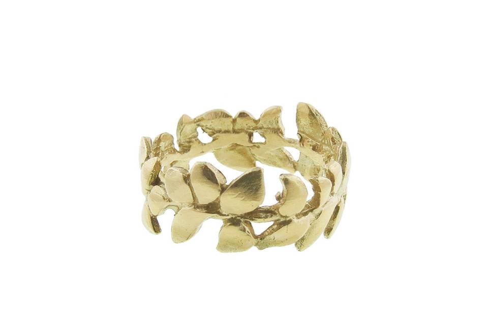 Natural beauty, handcrafted. This gorgeous band from Himatsingka features detailed Wisteria leaves crafted in 18 karat yellow gold. The wreath of leaves makes a perfect everyday band. It is 3/8