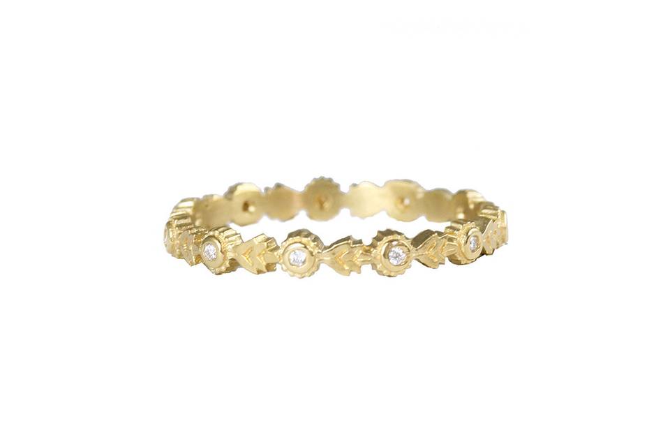 Megan Thorne's rings have an Old World feel with a sensibility to what her younger generation loves. This Wood Nymph eternity band has delicately carved wings, and a tiny diamond in the center. In 18 karat gold, it is great worn alone, or with Megan's Wood Nymph Solitaire. <p>Each Megan Thorne ring carried by Ylang 23 is in rose cut or brilliant diamonds, or a combination of both, and not with white sapphires (although her solitaires can be special ordered with white sapphires). Megan casts, fabricates and hand finishes every piece, and therefore can accommodate special orders of solitaires in many sizes and shapes.