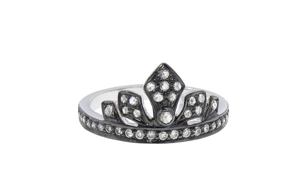 Feel like royalty in this fun Enchanted Garden Tiara Ring from designer Sethi Couture. Tiny diamonds are set on the front of the band and throughout the brilliant tiara. The ring is crafted from black rhodium over 18 karat gold and has .29 total carat weight. Who wouldn’t want to wear a tiara everyday?