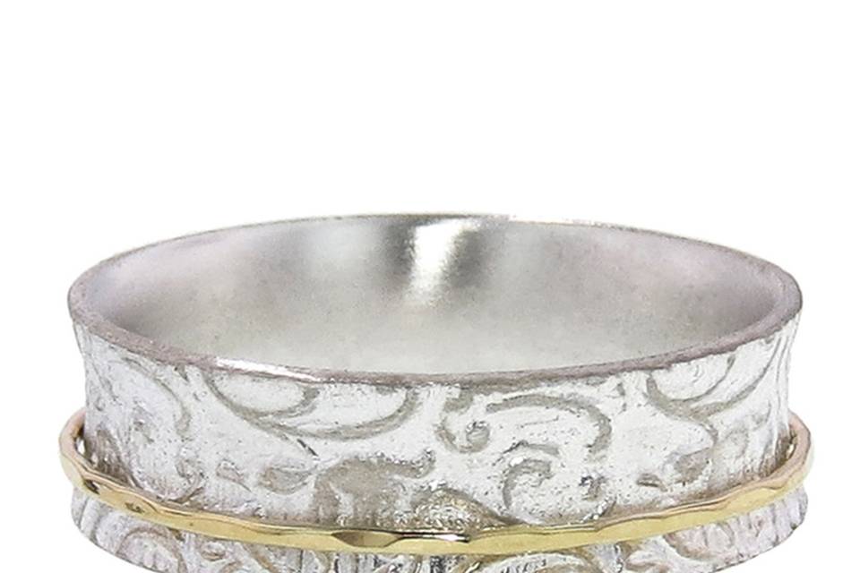 This wide band from artisan David Tishbi is composed of recycled sterling silver with a floral paisley design measuring 1/4