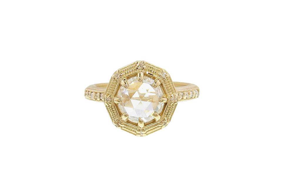 This Eight Sided Geo Ring from designer Megan Thorne in 18 karat yellow gold has a beautiful bezel set diamond center with a carat weight of 1.52 carats. The high polished band has diamond detailing of .09 carats. Worn alone or with Megan's 12 Stone Geo Band, the detailing is so beautiful, it is certain to become a family heirloom.