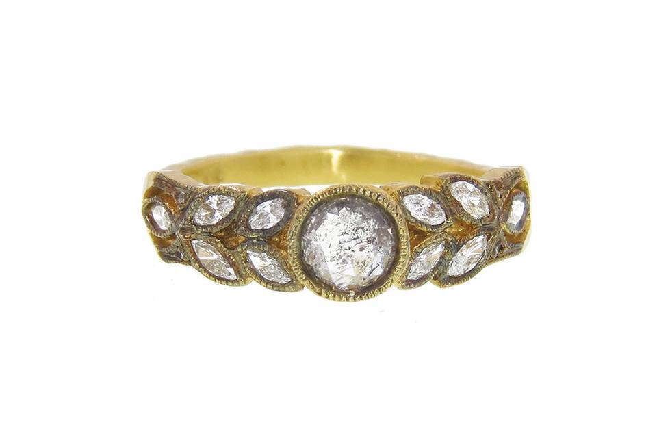 Simply stunning from Cathy Waterman, this round, rose cut ring is set in 22 karat gold with blackened detail and a .46 carat center diamond. The band is composed of bright diamond leaves, measuring 3/16