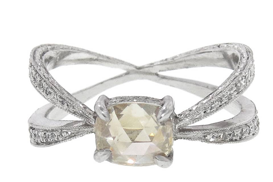 This one of a kind ring from jewelry designer Cathy Waterman has such a unique presence. The center stone is an oval rose cut rustic diamond with a carat weight of 1.01 carats and it is set on an infinity band of platinum with sparkling diamonds sent half way down. The band measures 3/8