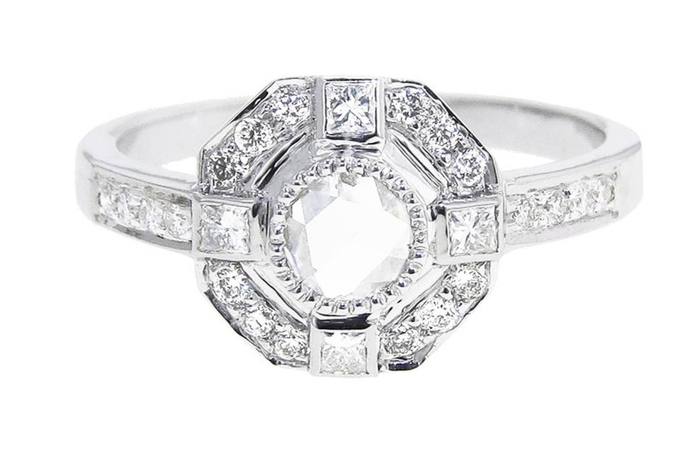 Attention boys and girls! If you're looking for a beautiful engagement ring this is serious contender. Sethi Couture's .43 carat rose cut diamond is surrounded by diamonds in a gorgeous antique inspired setting.