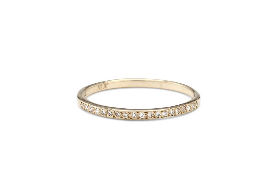 Each ring from designer Satomi Kawakita is handmade with impeccable precision. This diamond band, crafted from 18 karat yellow gold, is no exception. Detailed and lovely in a ring stack.