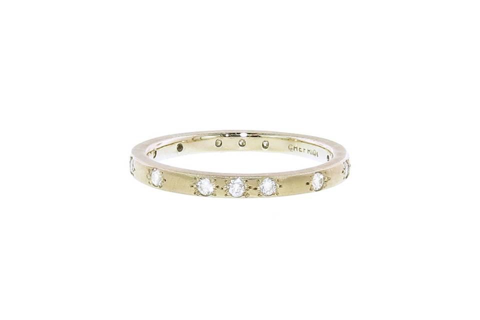 This dainty band from designer Adel Chefridi is fashioned in 18 karat white gold and features a matte finish sprinkled with brilliant diamonds The band is a perfect 6 1/2.
Please inquire about special orders.