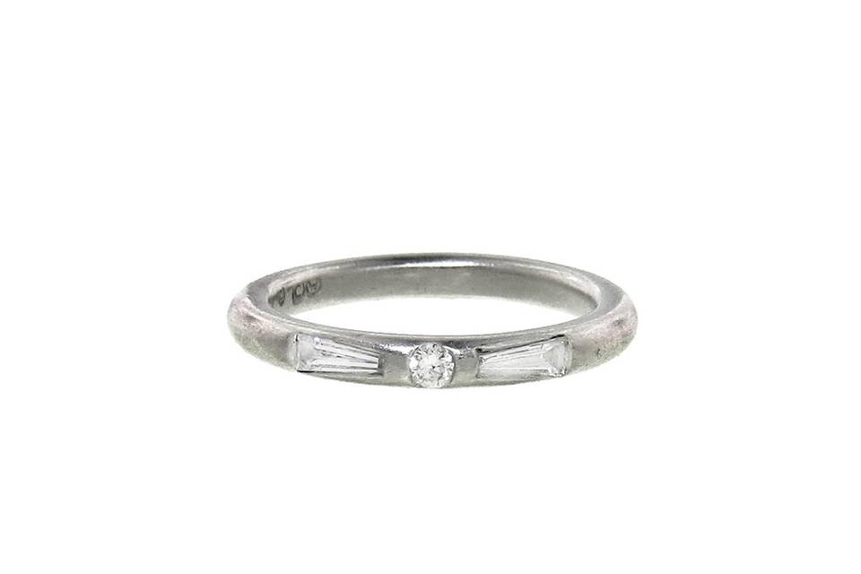 Each ring from designer Cathy Waterman is handmade with impeccable precision. This high polished band, crafted from platinum, is no exception. Detailed with a round diamond surrounded by diamond baguettes, this ring looks lovely in a ring stack. The diamonds total 1.32 carats.
