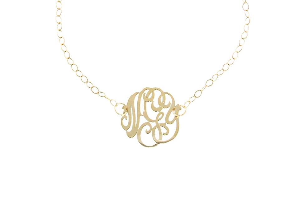 Personalize every day with this fun bracelet from Ginette NY! This bracelet features a 14 karat yellow gold small, cutout monogram that measures 3/4