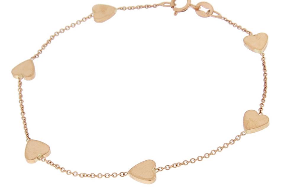 Very delicate and wonderful for layering, this bracelet from designer Jennifer Meyer is composed of small, 18 karat rose gold hearts spaced with delicate chaining. Measures 6 1/2