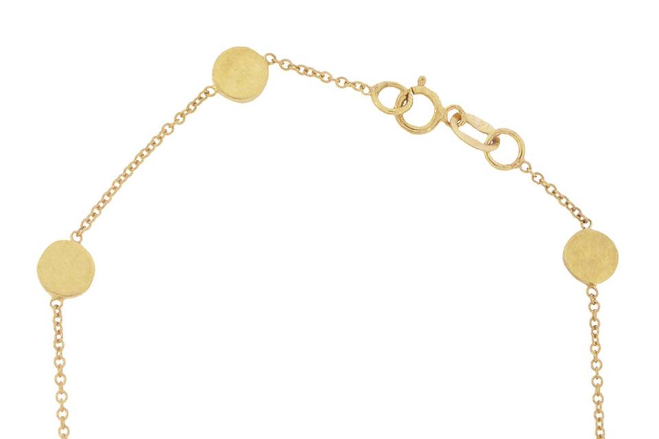 Very delicate and wonderful for layering, this bracelet from designer Jennifer Meyer is composed of 18 karat yellow gold, small circles spaced with delicate chaining. Measures 6 1/2