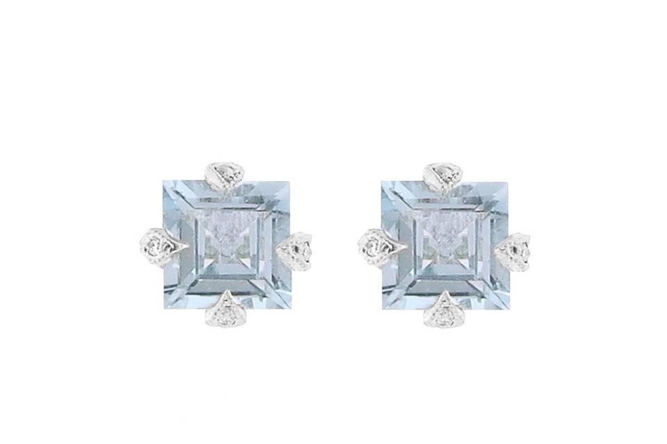 Detailed by hand in platinum, these classic studs by Cathy Waterman feature princess cut aquamarines prong set with tiny diamond accents. They measure 1/4