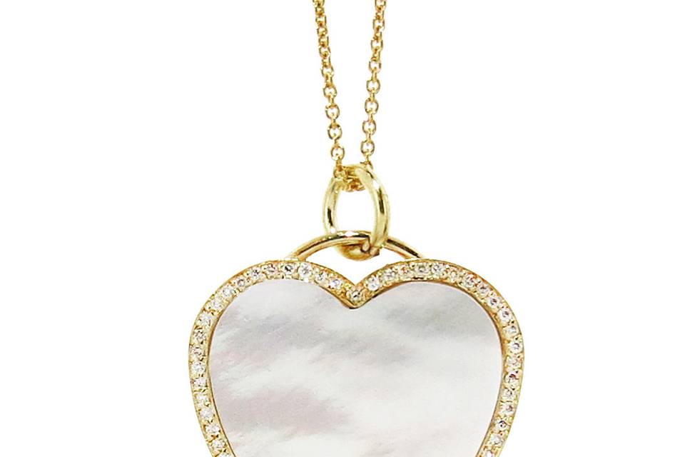 We <3 Jennifer Meyer, and are so in love with this new layering piece. Jen's updated her classic heart necklaces with this adorable mother of pearl diamond heart addition! Measuring 1