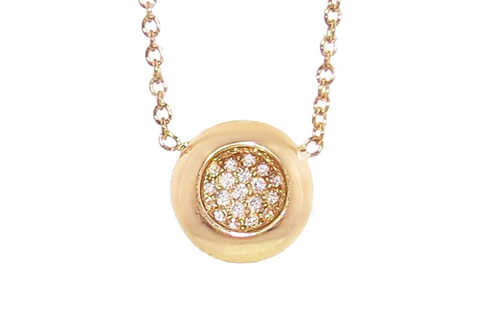 Every wardrobe needs a staple necklace and this Caren necklace from Melissa Kaye is a wonderful transition piece. Crafted in 18 karat gold , this high polish pendant pops with white diamonds. Each diamond is individually bezel set and rest inside the center of the pendant. The diamonds total .11 carats. The pendant measures 5/16