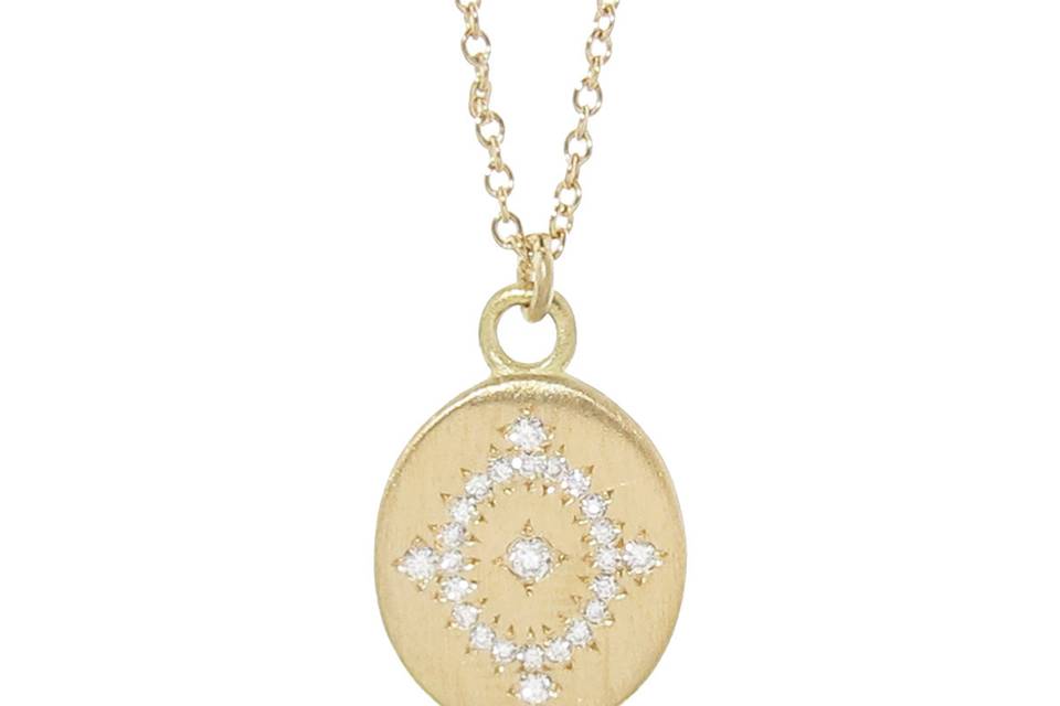 This stunning Daydream pendant from Adel Chefridi has a wonderful presence with intricate detail. An oval pendant has bright diamonds surrounding a diamond center in a starburst pattern and share a total carat weight 0.10cts. The pendant measures 1/2