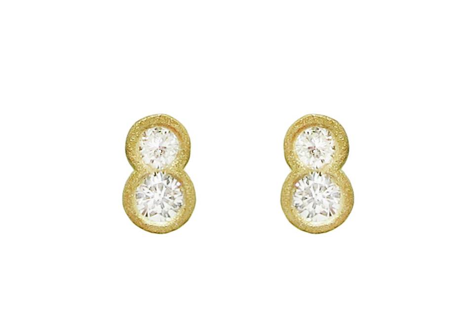 Simple studs, shaped to perfection from Tate. Fused diamond circles are bezel set in 18 karat gold and measure 1/4