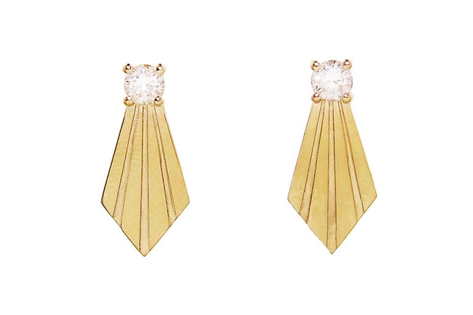 Lovingly detailed by hand, these Larisa Laivins earrings are great for enhancing your everyday look. Crafted in 18 karat gold, these earrings are topped with prong set diamonds and features gold etched drops. These earrings measure 5/8