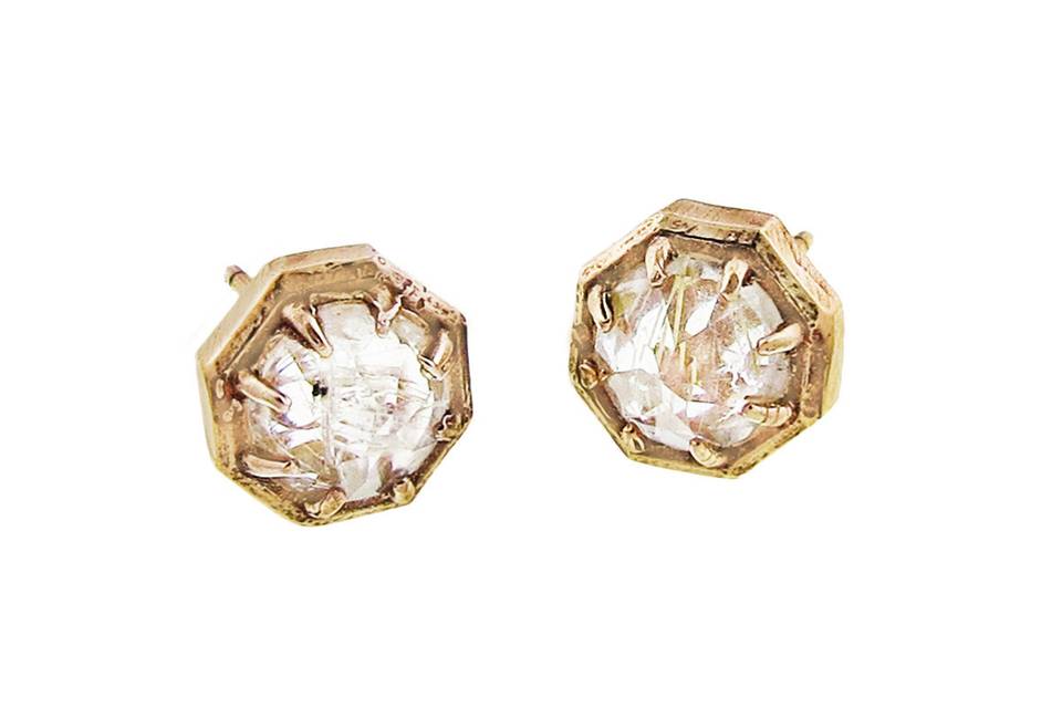 A playful pair of stud earrings from Lauren Wolf, these are crafted in a distinctive octagonal silhouette. These edgy studs feature yellow rutilated quartz prong set in a 14 karat yellow gold octagon setting. The stud measures 5/16
